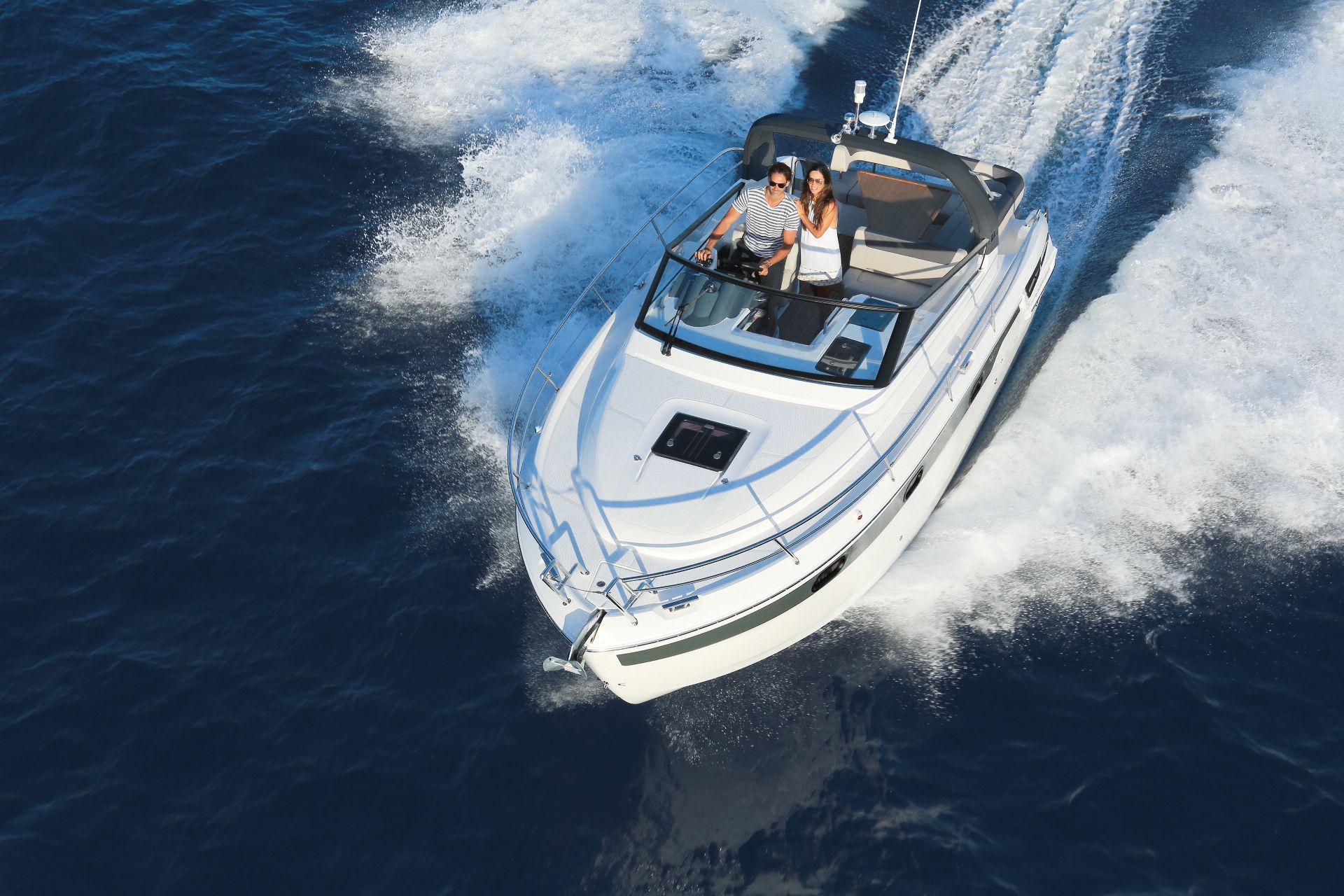 A couple enjoying the sea breeze, Motor boating in Spain book motor yacht online, motor yacht charter, motor boating, motor yacht